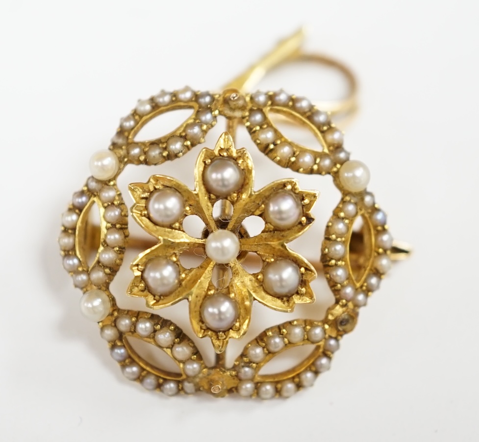 An Edwardian 15ct and seed pearl cluster set pendant brooch, overall 32mm, gross weight 5.3 grams. Condition - fair to good